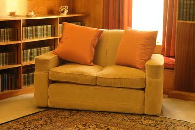 Silky Smooth Double Seater Sofa with Large Orange Cushions