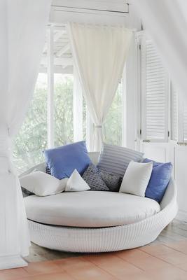 Silky White Round Sofa with Multiple Cushions